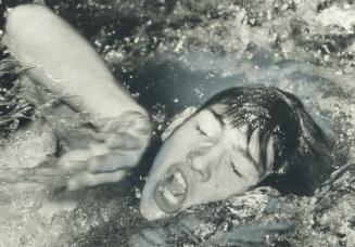 Strain of competing in men's 200-metre individual medley is depicted in face of Ray Entmaa of Swimtec Club during North York Aquatic Club's annual Hal(...)