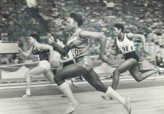 Christie Brehmer of East Germany, left, edged American Chandra Cheeseborough (102) in the semi-final of women's 50-yard dash