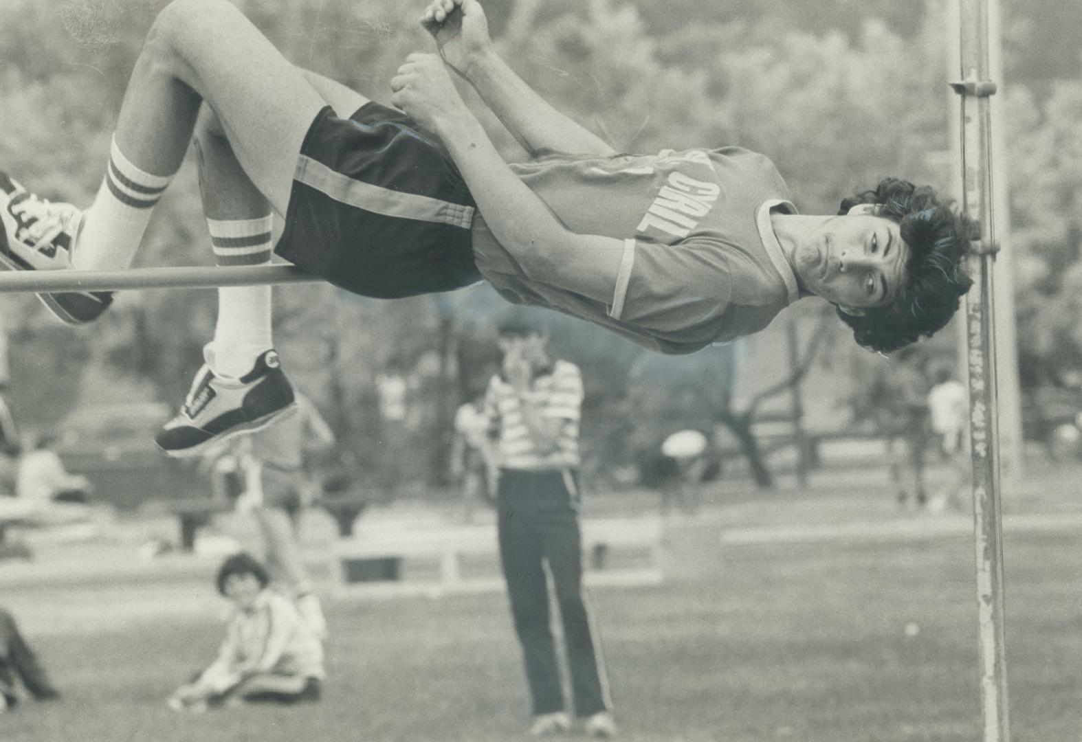 Marco Dechellis coped with a slippery runway and set a record in the senior high jump at Separate Schools track championships