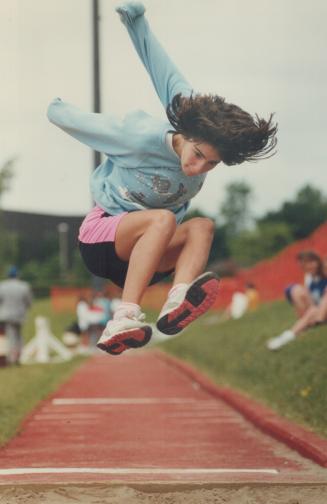 Time to take a flying leap. The tailwind was chilly, but 12-year-old Janet Falcone of St. Louis elementary school had an idea. She kept her hands warm(...)