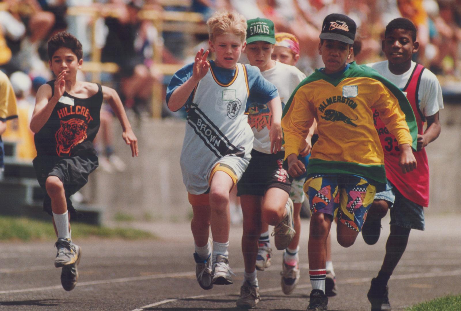 These 11-year-olds are all concentration during the boys 400 metres race at North Toronto Public Schools' track and field final at Lawrence Park Collegiate yesterday