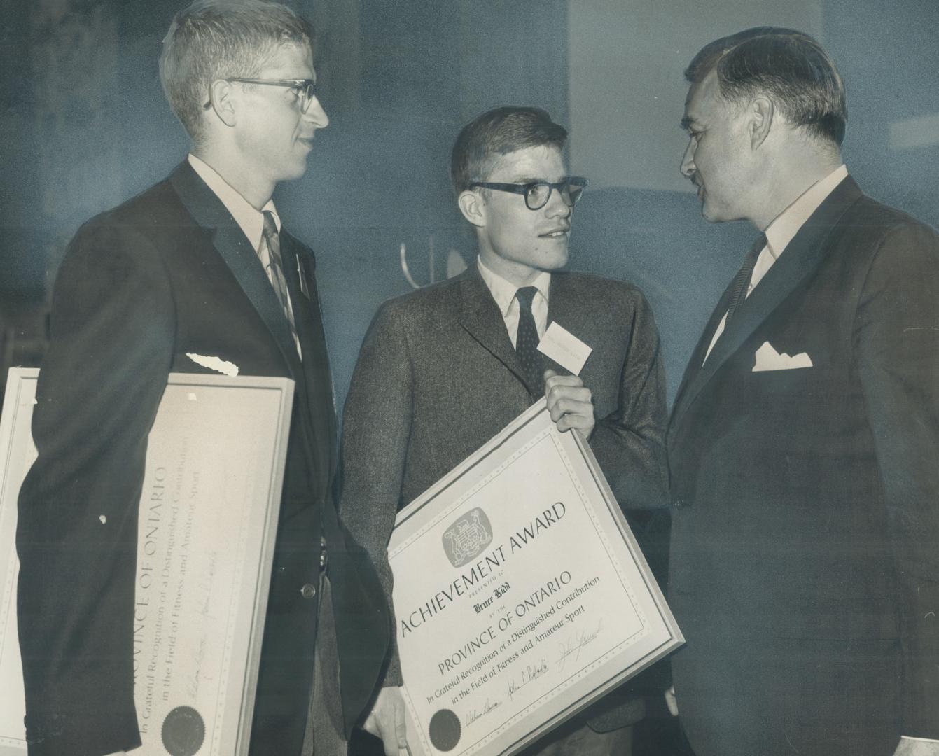 Premier John Robarts congratulates two great runners