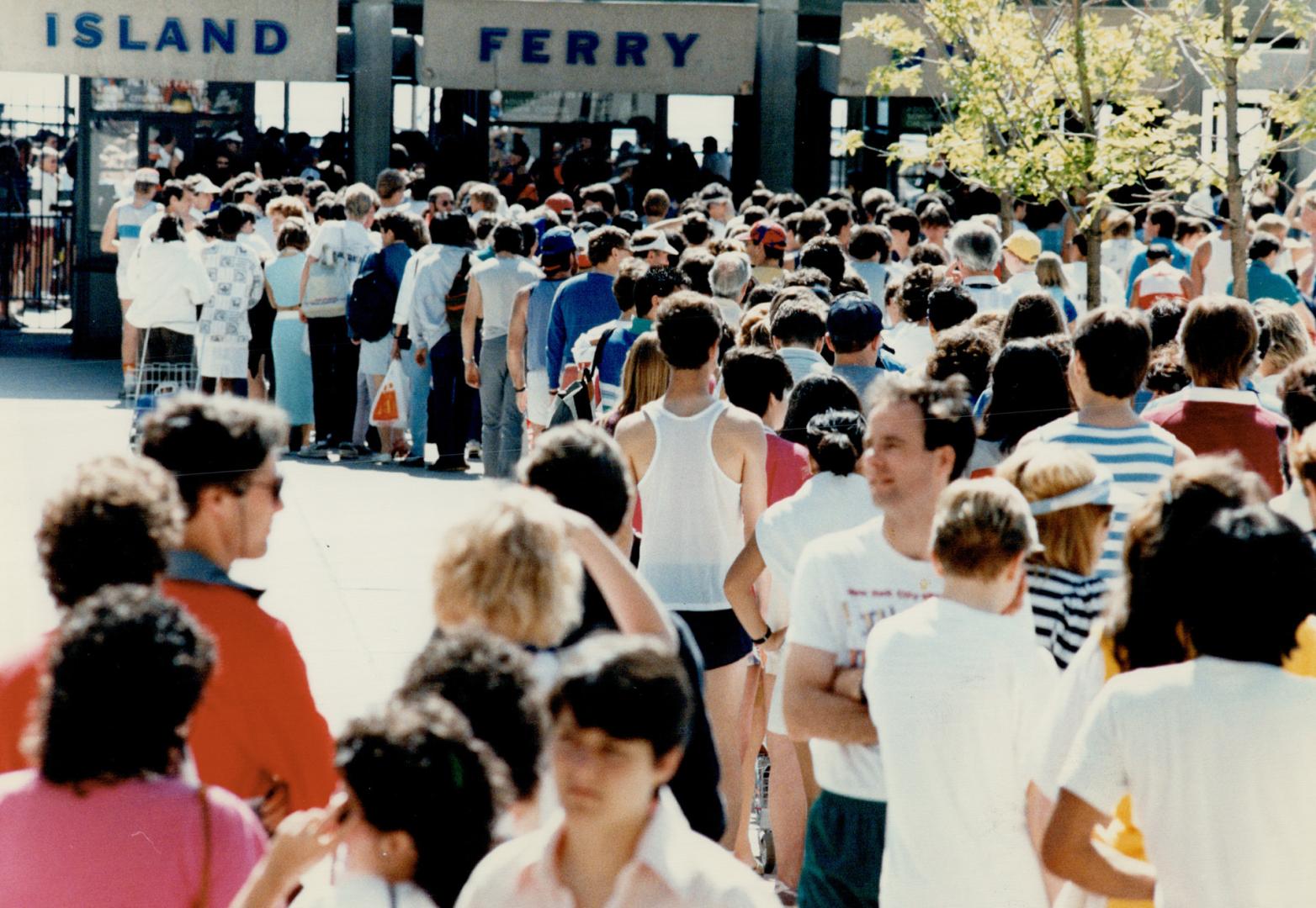 Participants and well-wishers line up at the foot of Bay St