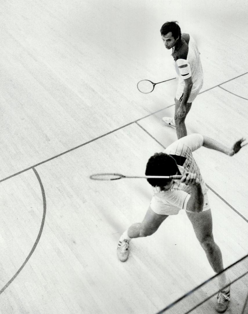 Title shot: John Nimick of Philadelphia backhands a return in his hard ball match with Anil Nayar of New York that decided the Canadian Open amateur championship at Toronto Squash Club yesterday