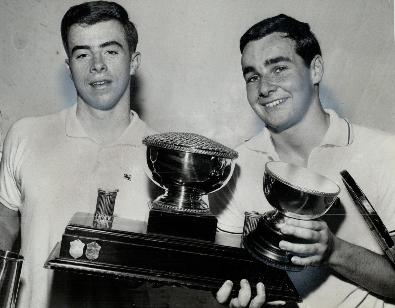 Steve Noyes (right) poses with Toronto and District Squash Racquets trophy he won over Colin Fraser (left) at Toronto Racquet club Saturday