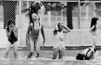 Chilling out with friends in the shallow end of Monarch Park Pool