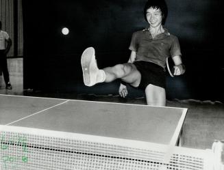 Sole Game Canada's junior table tennis champion Joe Eng displays his shoe re-against Italy's Rosario Troili