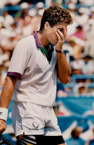 Don't look now: American Jay Berger can't bear to look after losing a point in championship match against Michael Chang yesterday at the Canadian Open