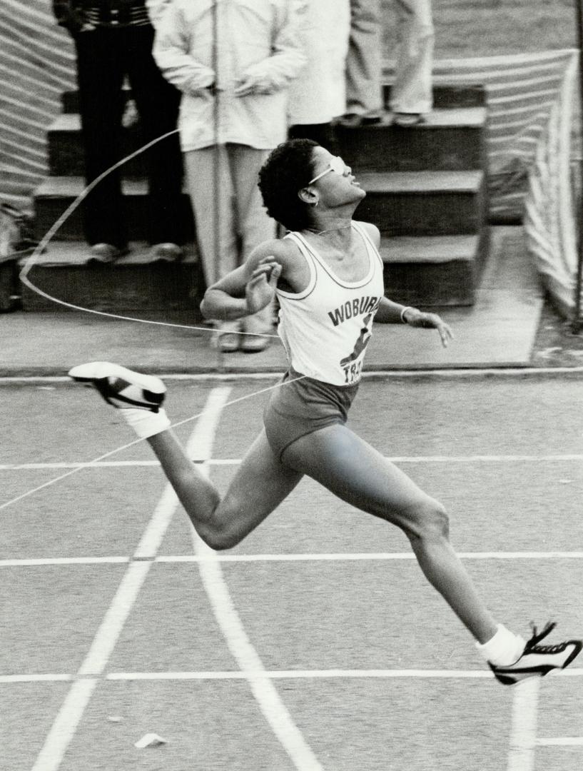 Woburn's Nicole Ali breaks the tape in midget girls' 100 metre