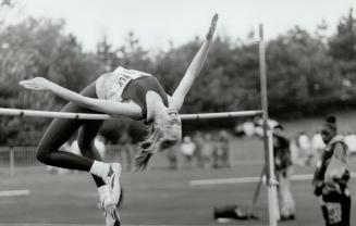 Rising to the challenge. Carolyn Chanler of Governor Simcoe in St. Catharines bends over backwards to get a medal. Here, she gets at least half of her(...)