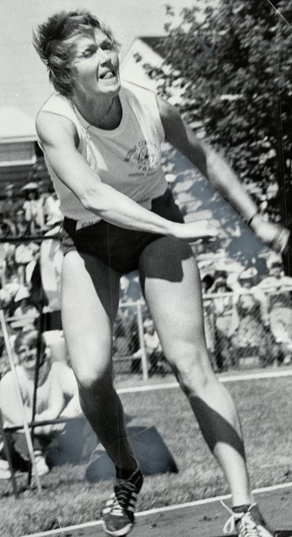 Strain shows in face of Jay Dahlgren as she hurls javelin a distance of 162 feet, 4 inches to win gold medal in event for British Columbia at Canada Games