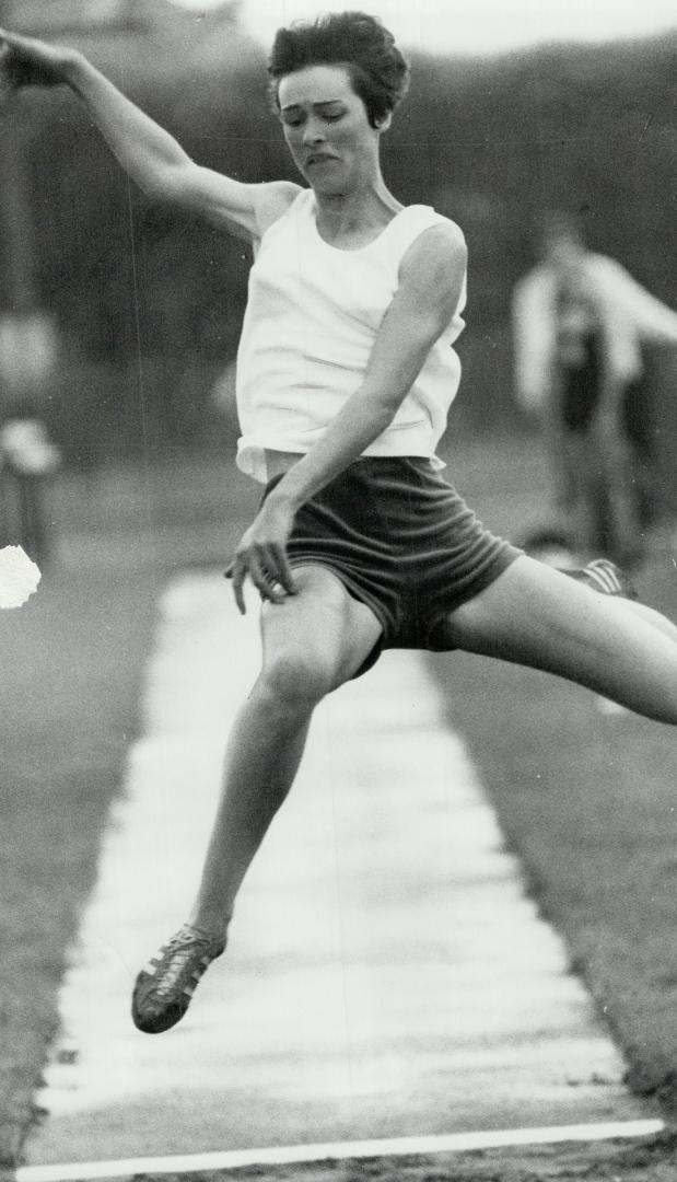 Joan Hendry of Montreal has almost ballet from in winning the women's long jump with distance of 17 feet, 8 3/4 inches