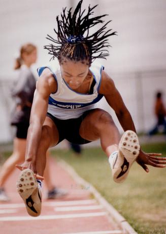 Marion Ogarro stretches to the limit in the senior girls' long jump yesterday at the Scarborough-Durham track and field championships in Oshawa