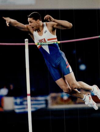 Up and over: American Dan O'Brien soars over the pole vault bar on his way to winning the heptathlon competition