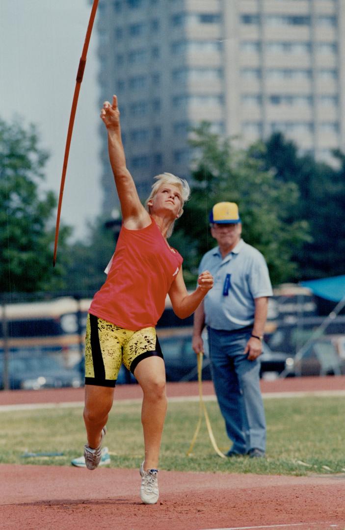 She's a triple threat. Lindsay's Binkie Sparboom gives winning heave to javelin at Ontario track and field event. Binkie also won both the shot put and discus for under-15s