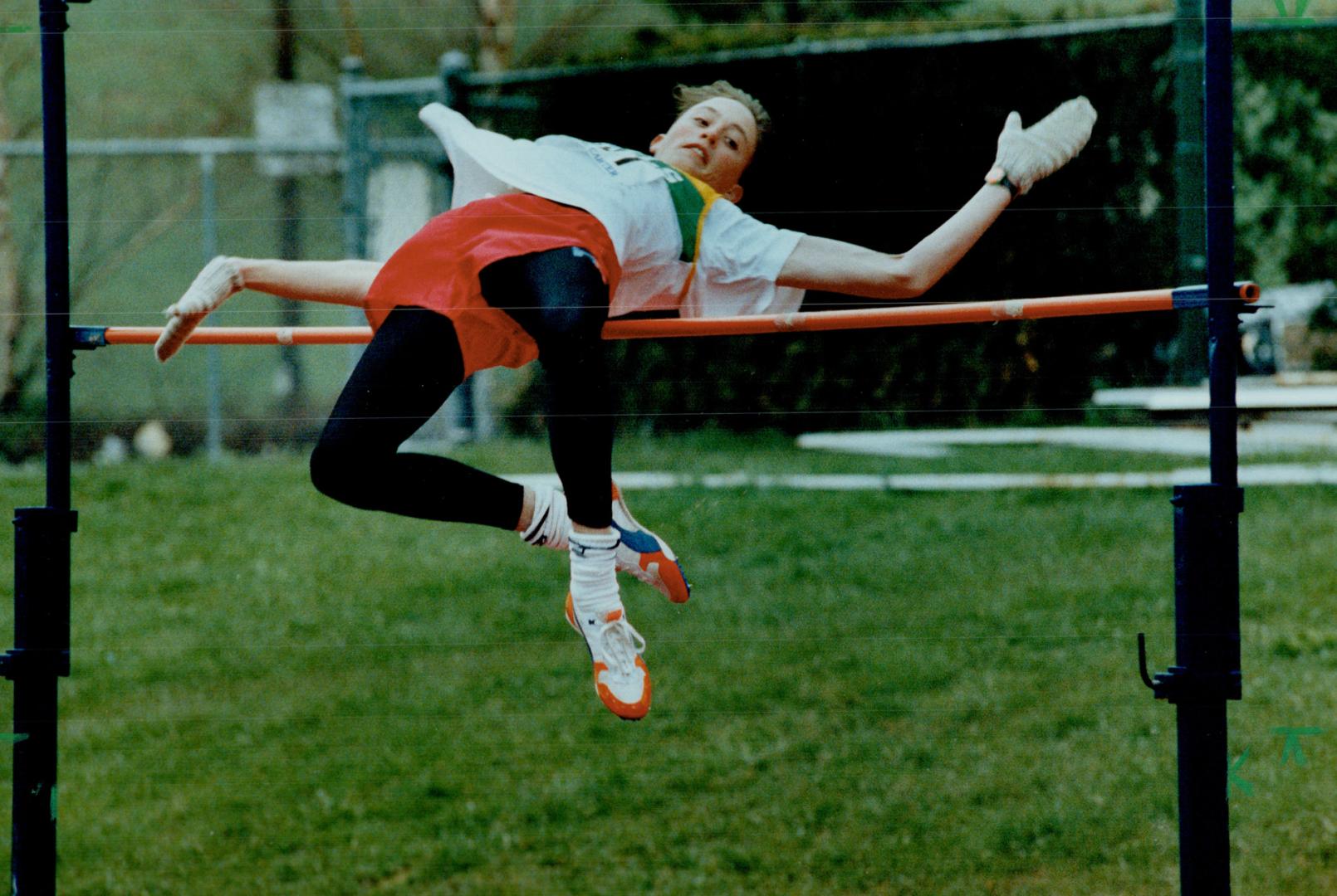 He was no Flop: Jason Thomas, 16, of Kitchener's Cameron Heights high school, soars to a second-place finish yesterday in high jump event at the first annual Cardinal Carter Track Classic