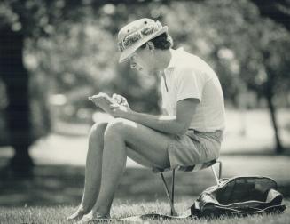 Portrait of Artist in the Park, Barry Coombs, a watercolor and pencil instructor at the Art Gallery of Ontario, is lost in his sketchbook in the tranquil shade of a verdant Queen's Park