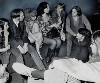 Author of Futz arrives in Toronto, Rochelle Owens (centre, with handbag on lap) talks with members of cast of the controversial play Futz, which she wrote