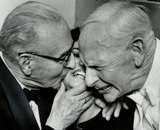 Author Healey Willan, left, librettist John Coulter congratulate Jeannette Zarou