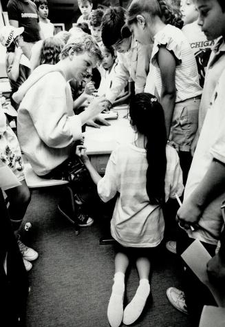 Real Snake: Hoping to get an autograph, Forest Manor student Yuriko Sano kneels beside DeGrassi Junior High star Stefan Brogren