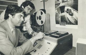 CKFM's Jerry Good, seated, and Tiercel's Phillip MacDonald check one of their dialers