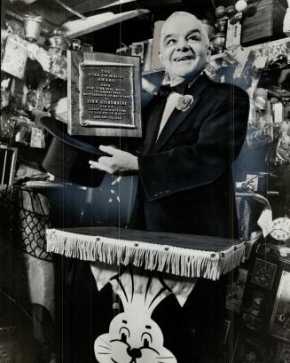 Johnny Giordmaine, in Trick shop, holds star of magic award, Prize is the latest of many won by the great Canadian magician