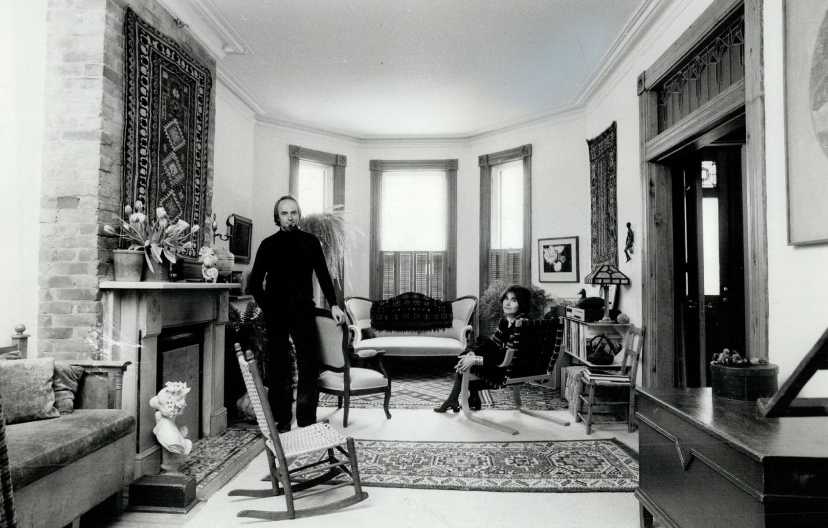 Warm living Space: Above, Terence and Catherine Helmer relax in their living room, an old-fashioned parlour updated for modern family life