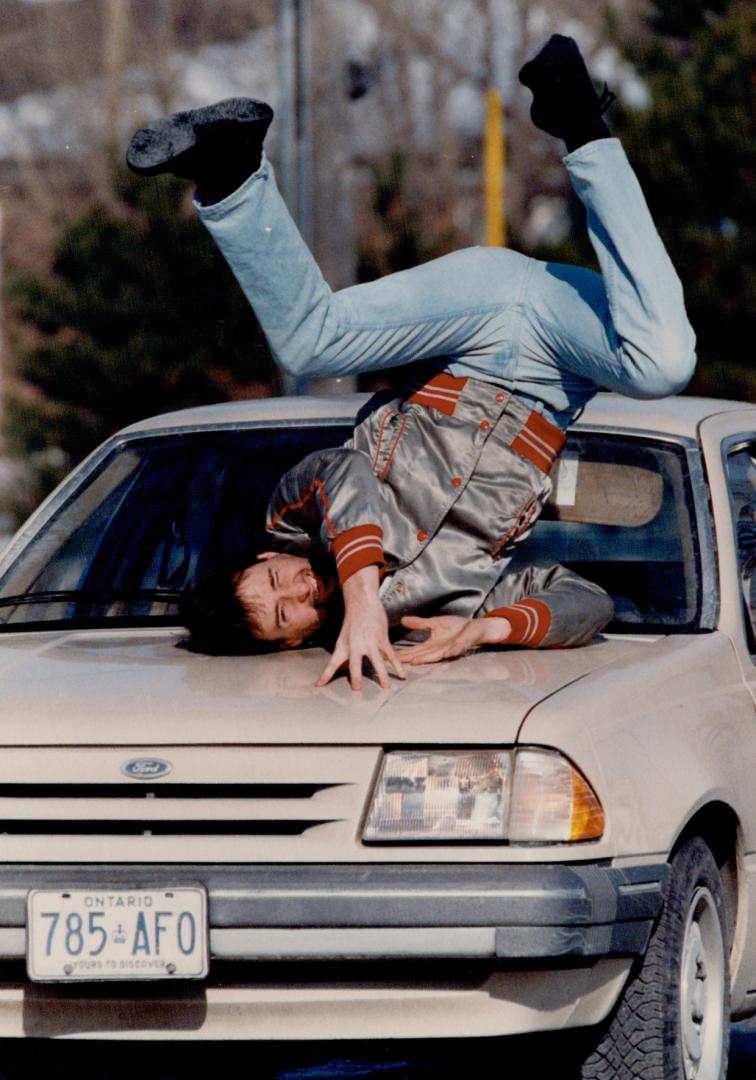 Car 'hits' Willowdale stuntman, Stuntman Rob Wilton, a Willowdale resident, is 'hit' by a car during a demonstration of his unusual talents