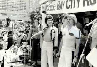 Five young Scottish rock stars, the Bay City Rollers, wave and smile at the thousands of fans who thronged Nathan Phillips Square yesterday. But mobs (...)