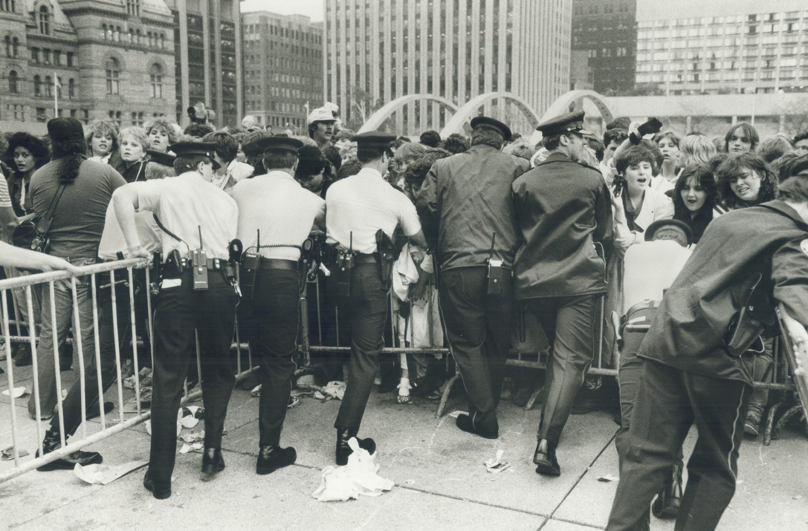 Mob scene at city hall party. Many fans were crushed against barricades as more than 20,000 people jammed into Nathan Phillips Square for a Toronto bi(...)