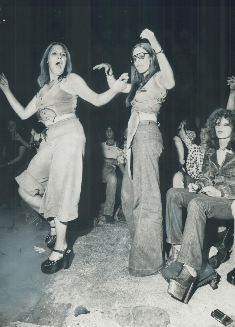 Fans dance during one of the Rolling Stones' concerts in Toronto