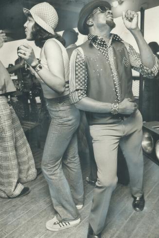 Strangers when they on the harbor cruise last night that officially opened Caribana '74, the West Indian carnival, Susan Scott of Jamaica and Bob Mari(...)