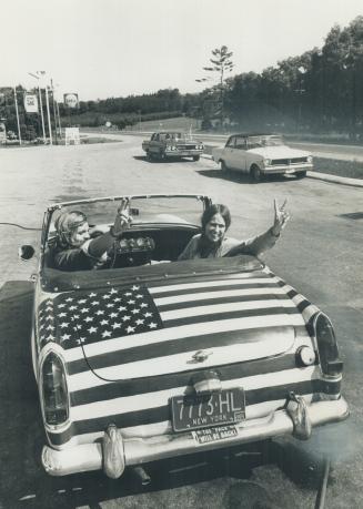 Heading for the festival in a car painted with a huge U