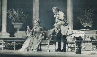 Stage production of The Marquise, with Glynis Johns (seated) and a male actor standing behind h…