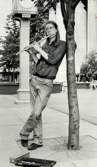 Playing for his tuition: 17-year-old John Lunn, from Belleville, plays his flute each day at Union Station to raise money for music studies