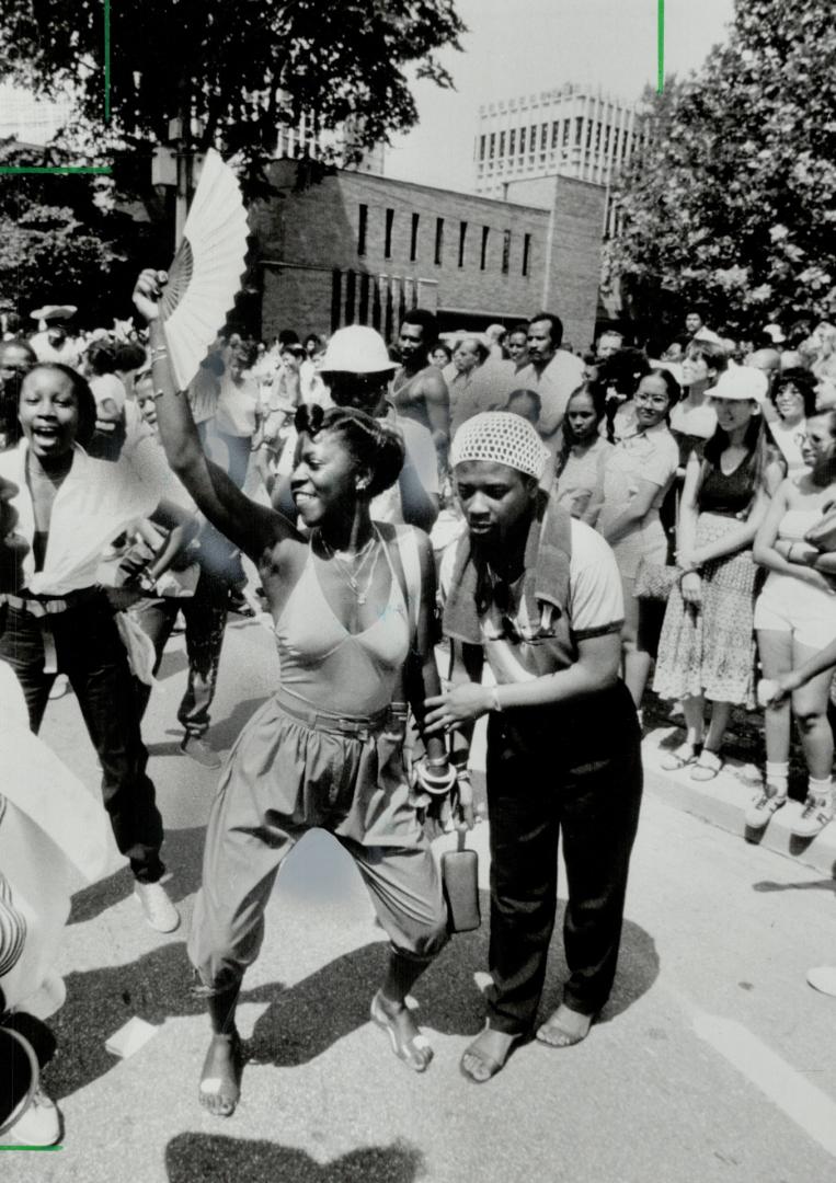 Jump-up time: Reggae and calypso bands had everyone swaying to the shrilling of whistles and the beat of steel drums as Caribana took to the streets yesterday