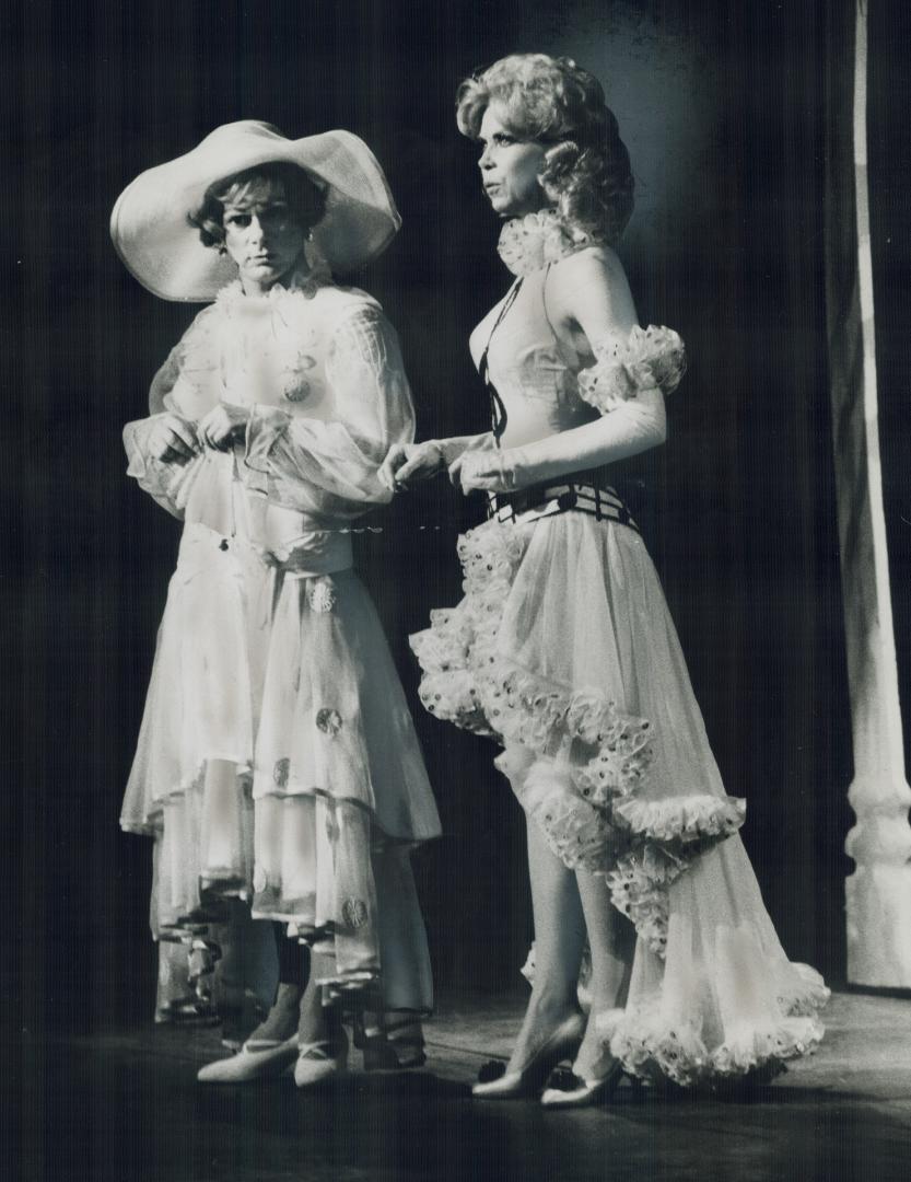 Disguised as a flapper, Robert Morse (left) stars with Elaine Joyce in title role of Sugar in musical at the O'Keefe Centre last nigh. Critic Urjo Kar(...)