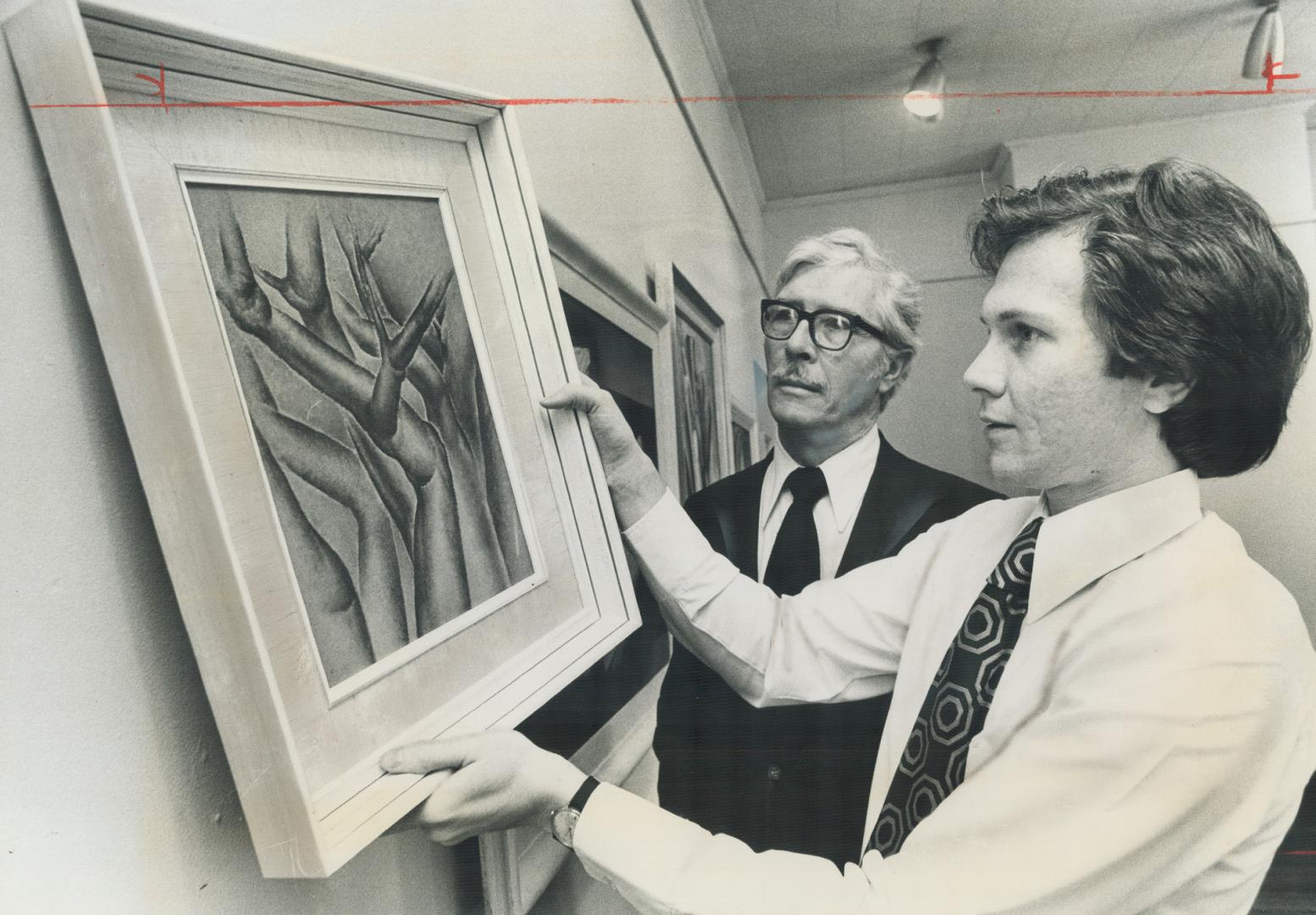 Tree trunks, a 1938 painting by Bertram Brooker, who died in 1955, is placed in position at the Morris Gallery on Prince Arthur Ave. by John Morris, w(...)