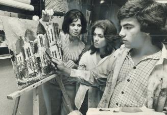 Art teacher Mary Carmichael (left) pupil Guiomar de Sousa, 13, watch Guiomar's brother Amadeu painting in Mrs