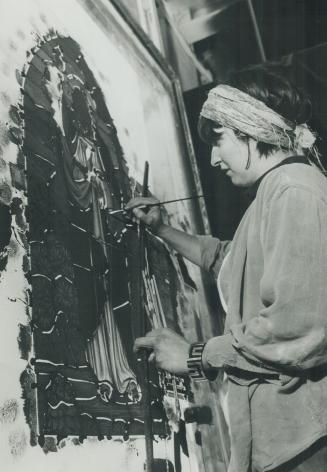 One of many: Cheryl Berthelotte paints a traditional Christ with Chalice window which is destined for a church in Alberta