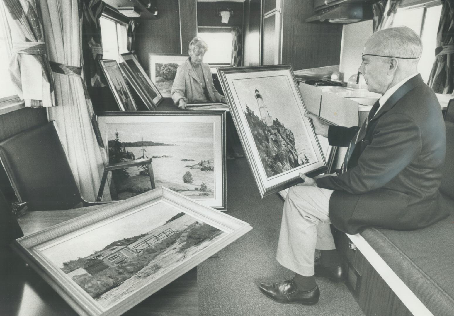 Artist art Ross and his wife, Anne, look over his paintings in the trailer which is their home for six months of the year. The couple spent the summer(...)