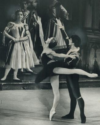 The swan, new style. Svetlana Beriosova and Donald MacLeary in scene from Swan Lake at Maple Leaf Gardens last night. The Royal Ballet's new presentat(...)