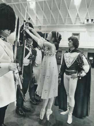 On her toes with a rose. The rose is a symbol of love and that's what those ill-fated lovers Romeo and Juliet brought to Fort York Armory yesterday. K(...)