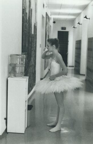 Thirsty after a rigourous session, 17-year-old Sophie Letendre of Sillery, Quebec, pauses for a drink at the water cooler