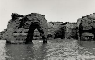 The restless sea carves and sculpts the hard sand cliffs that fringe the shores of Quebec's lies de la Madeleine