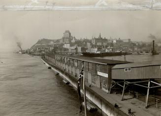 view of breakwater and Quebec city, taken from Cunard liner Andania