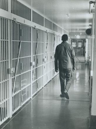 Guelph Inmate walks past cells in block