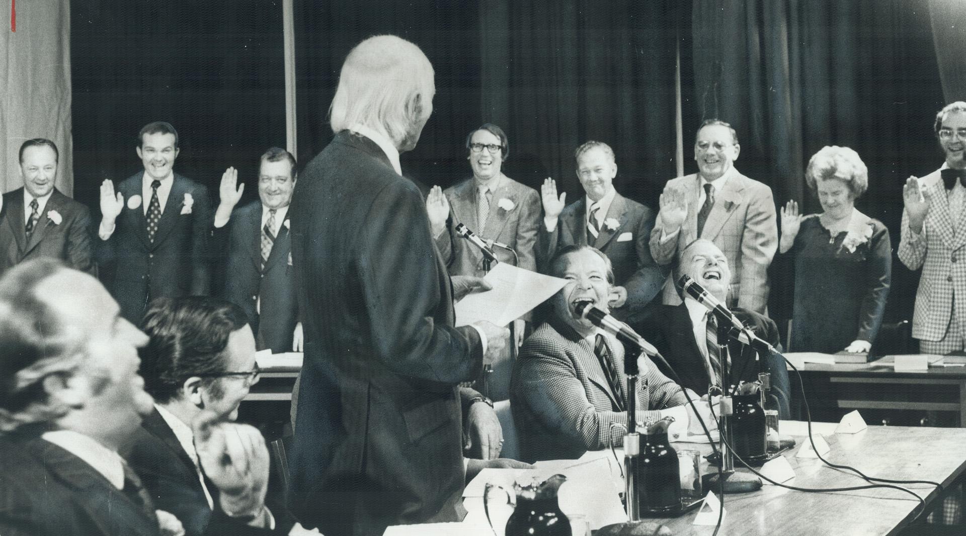 Lt.-Gov. W. Ross MacDonald swears in the new Halton Regional Council last night in Central High School, Burlington. After the inaugural meeting, the c(...)