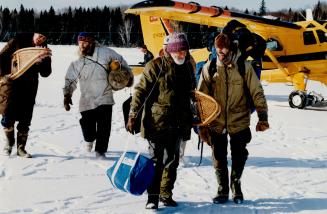 Heading Out: James Raffan, above far left and Jim Greenacre, centre, pull their packs