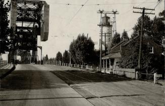 The big lift bridge at Burlington Beach and its neighbors the old lighthouse and ancient residence built when the canal was first opened